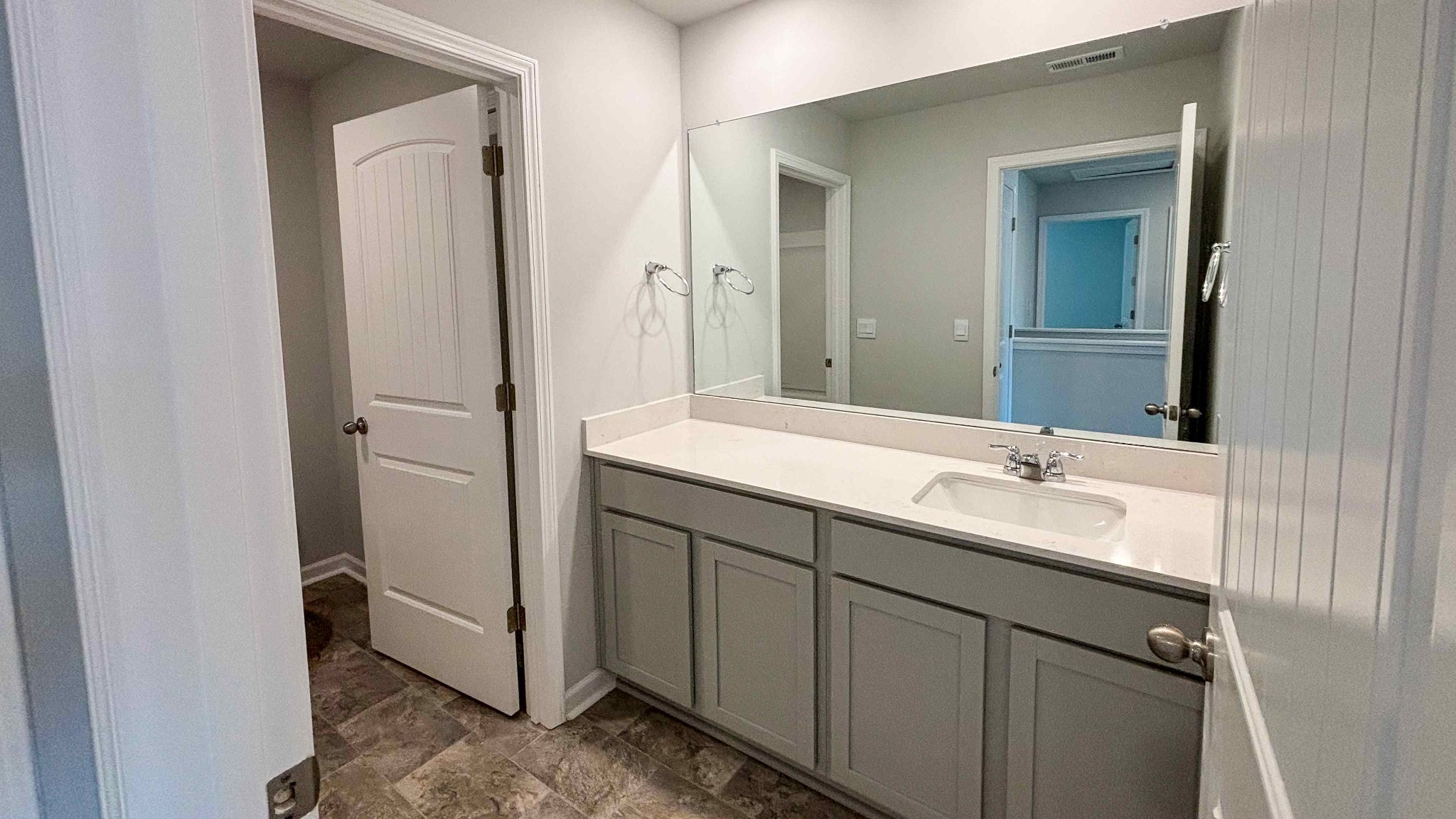 301 Harvest Point Boulevard Spring Hill, TN 37174 - Photo 23 of 25 a bathroom with a double vanity sink and mirror