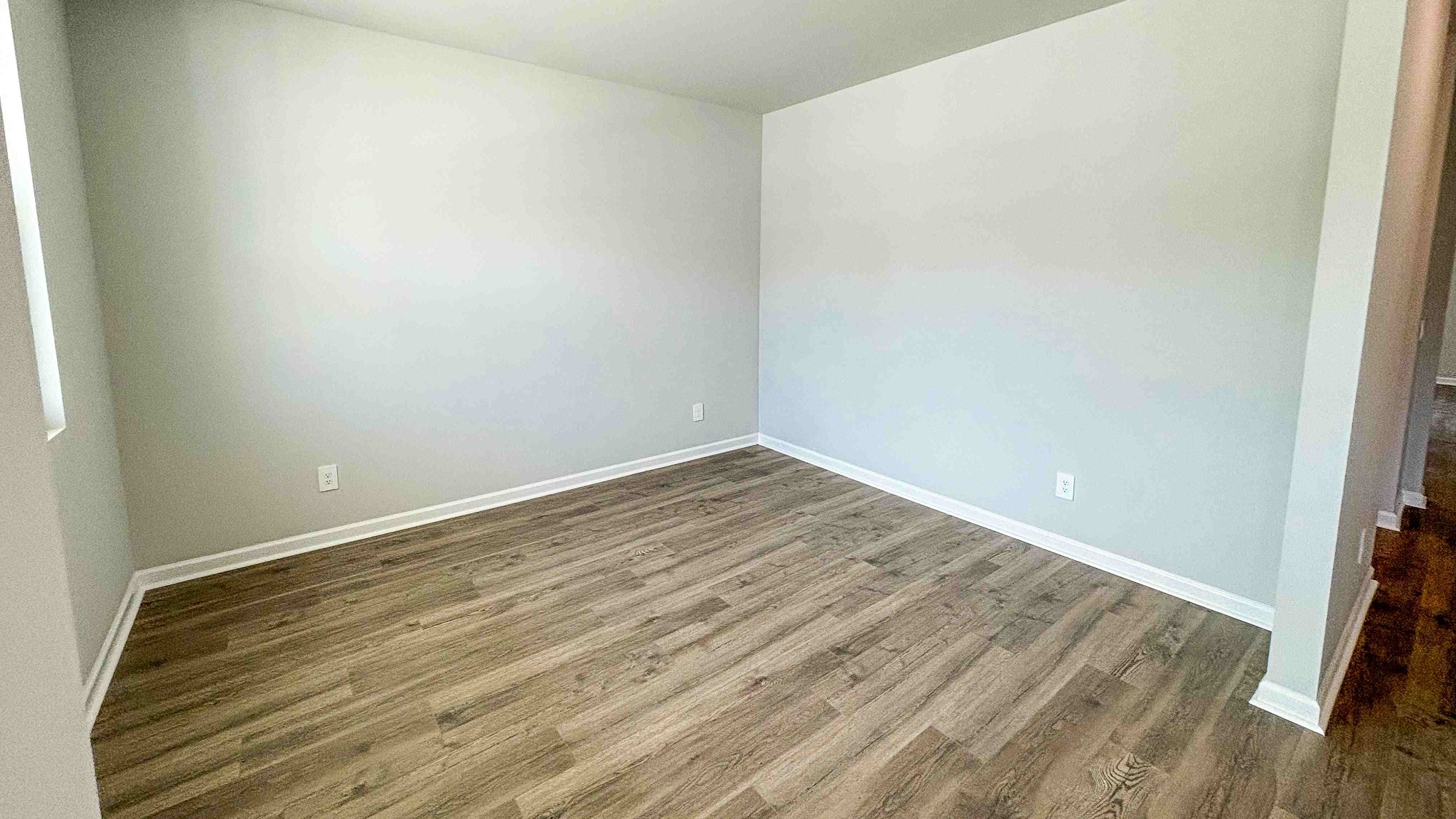 301 Harvest Point Boulevard Spring Hill, TN 37174 - Photo 4 of 25 a view of an empty room with wooden floor