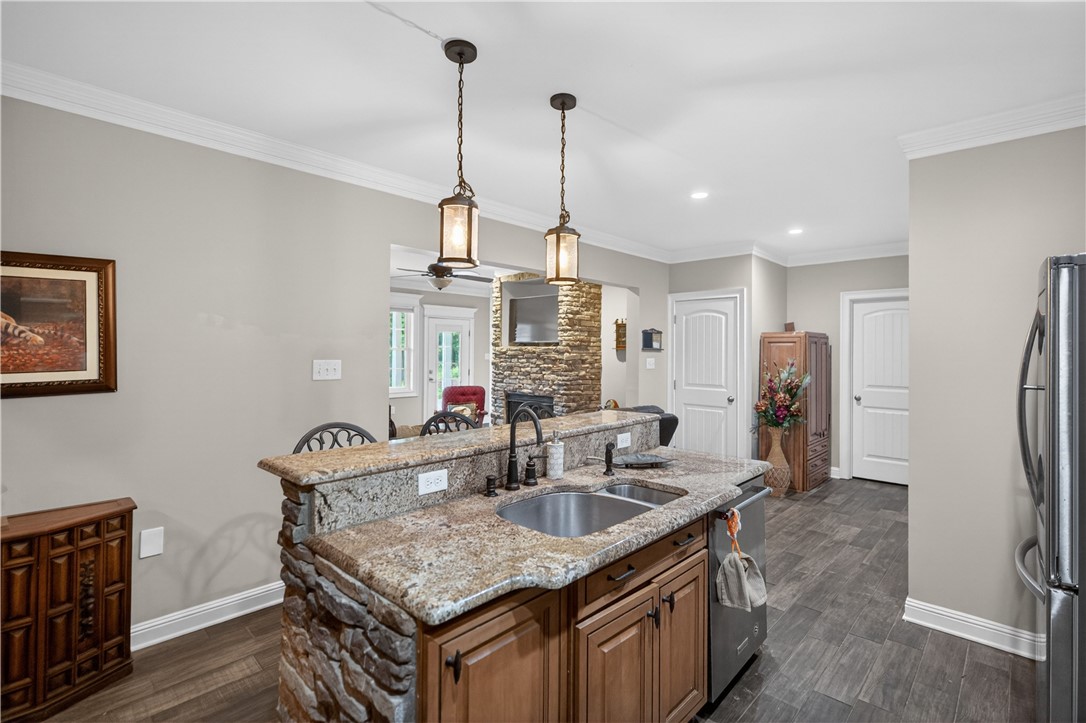 206 James Hare Road Anderson, SC 29626 - Photo 14 of 37 A well-appointed kitchen features a stone-accented island and modern amenities.