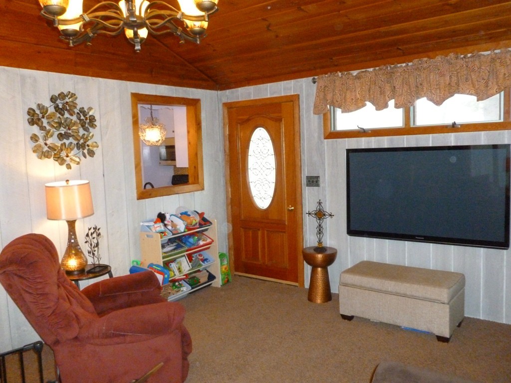 78 Westchester Circle Dedham, MA 02026 - Photo 12 of 24 a living room with furniture a window and a flat screen tv