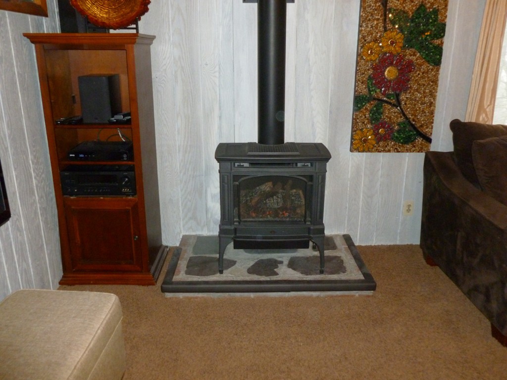 78 Westchester Circle Dedham, MA 02026 - Photo 13 of 24 a living room with a fireplace and a window