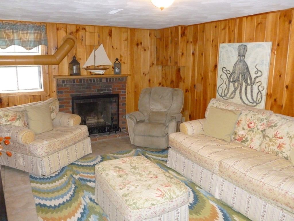 78 Westchester Circle Dedham, MA 02026 - Photo 21 of 24 a living room with furniture and a fireplace