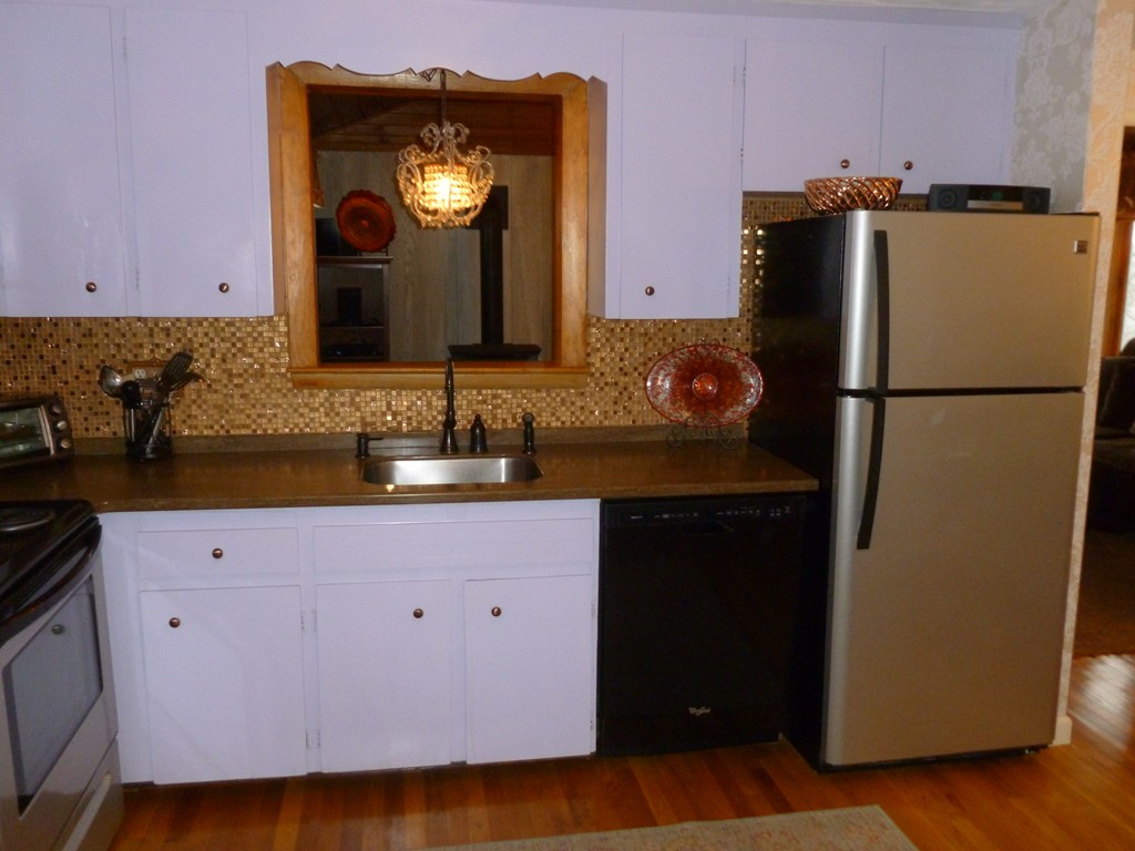 78 Westchester Circle Dedham, MA 02026 - Photo 9 of 24 a kitchen with a refrigerator and a sink