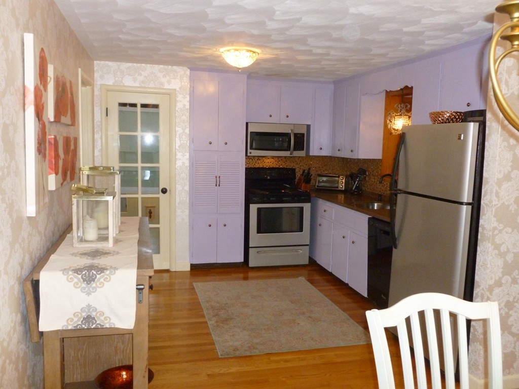 78 Westchester Circle Dedham, MA 02026 - Photo 10 of 24 a kitchen with stainless steel appliances a refrigerator and a stove top oven