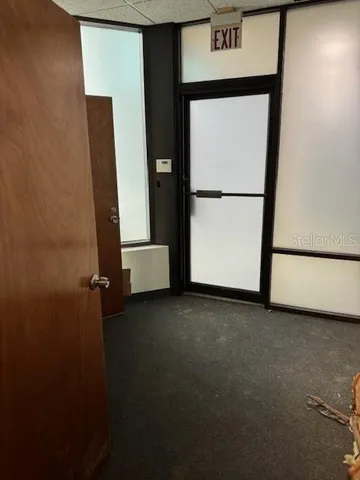 a bed room with a bed and a television