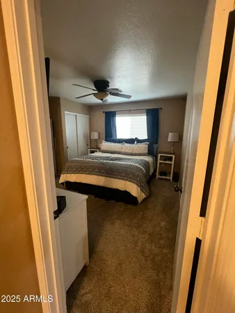 a view of living room with furniture and a flat screen tv