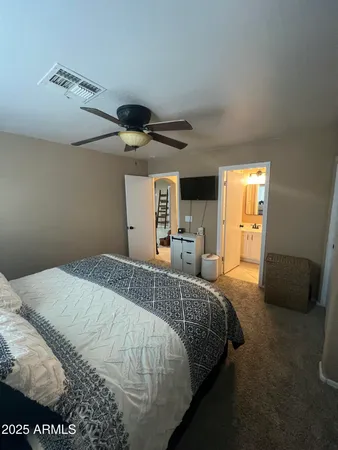 a bedroom with a bed and a walk in closet