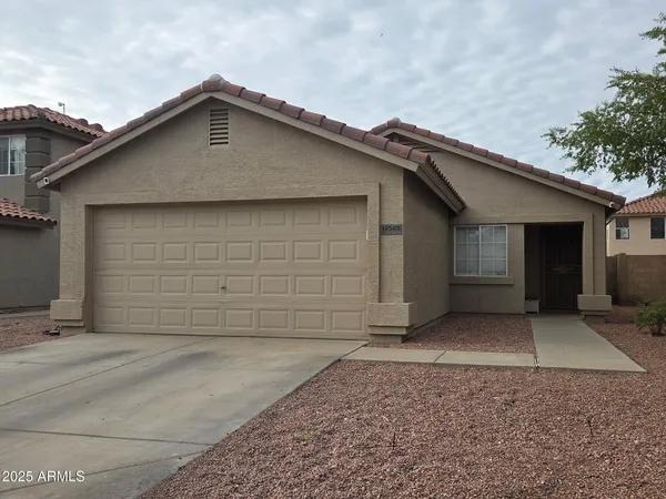 a front view of a house with a garage