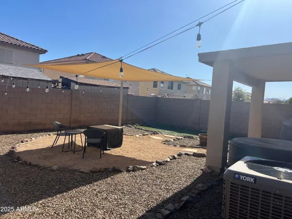 a wooden bench sitting in front of a building
