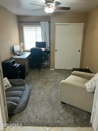 a living room with furniture and a window