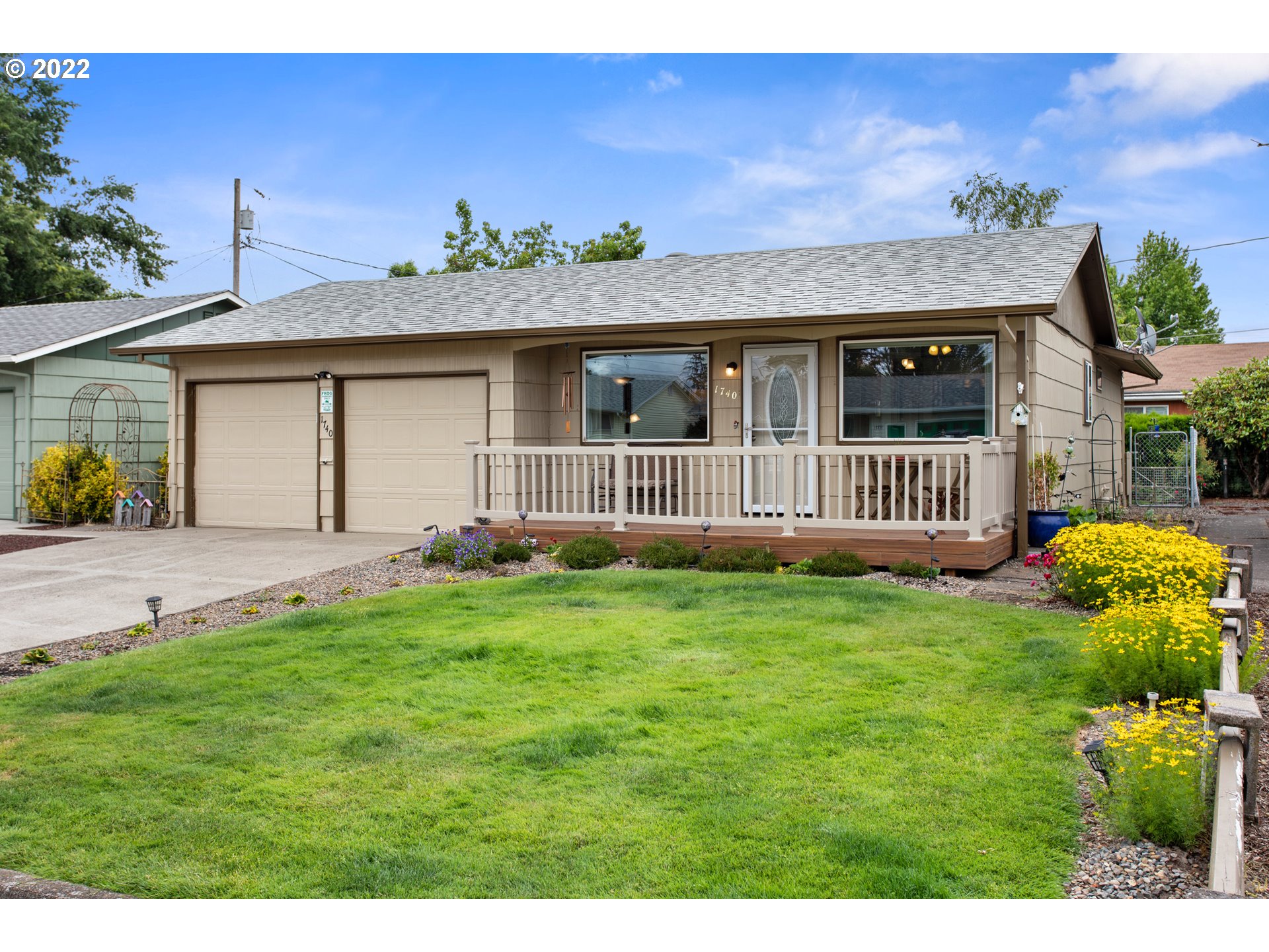 1740 Jansen Way Woodburn, OR 97071 - Photo 26 of 30 a view of a house with a yard and garden