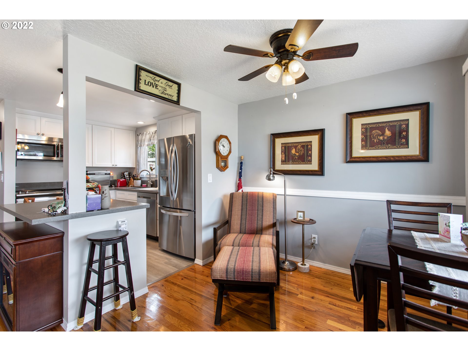 1740 Jansen Way Woodburn, OR 97071 - Photo 6 of 30 a living room with stainless steel appliances furniture and a kitchen