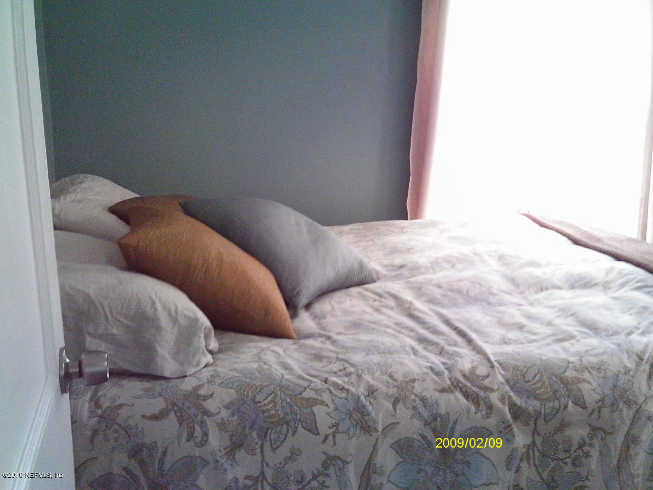 2045 Kingswood Road Jacksonville, FL 32207 - Photo 20 of 22 a bedroom with a bed and a window