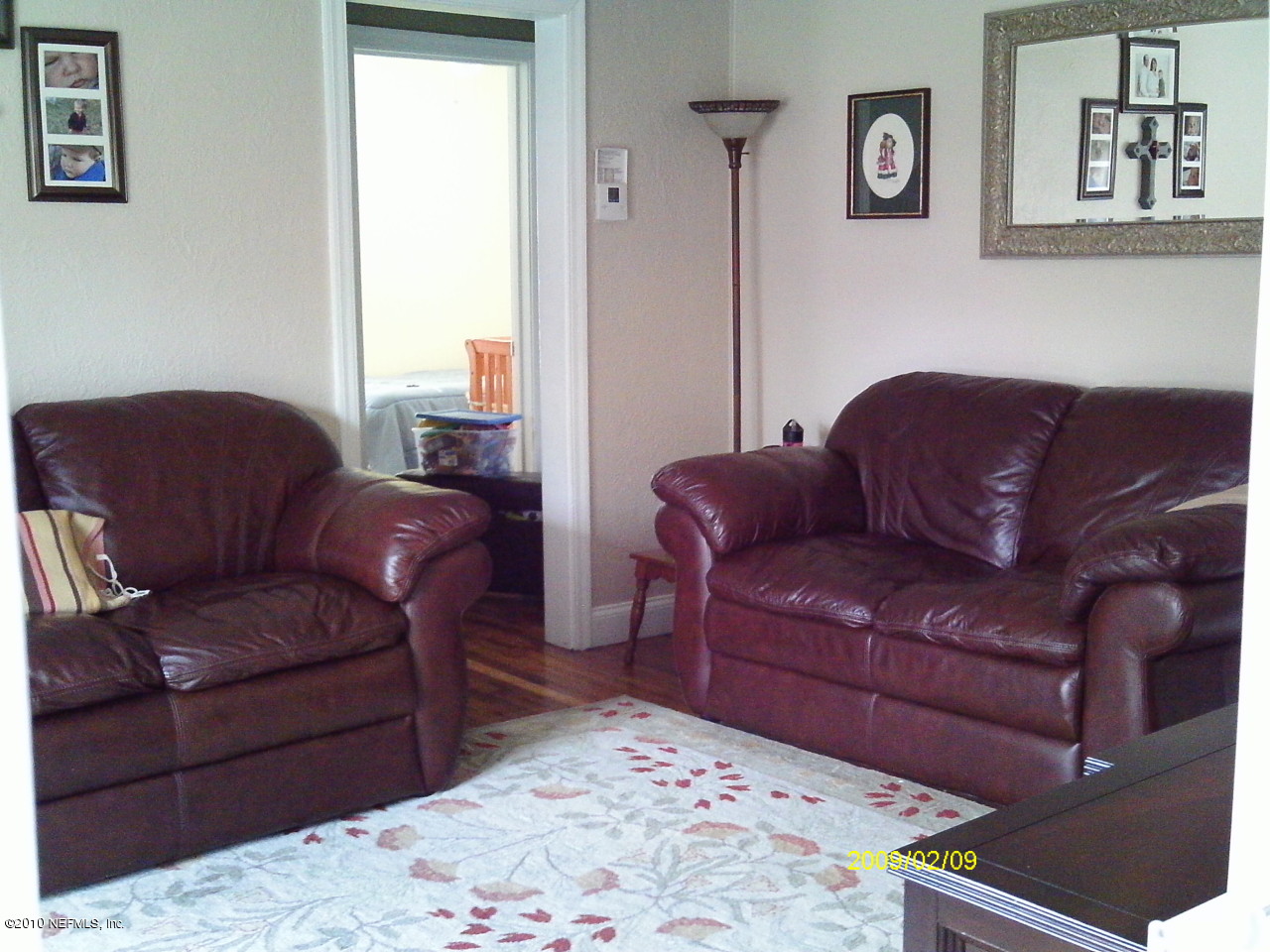 2045 Kingswood Road Jacksonville, FL 32207 - Photo 3 of 22 a living room with a couch and a dresser