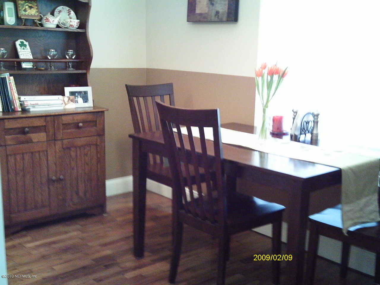 2045 Kingswood Road Jacksonville, FL 32207 - Photo 9 of 22 a view of a dining room with furniture and wooden floor