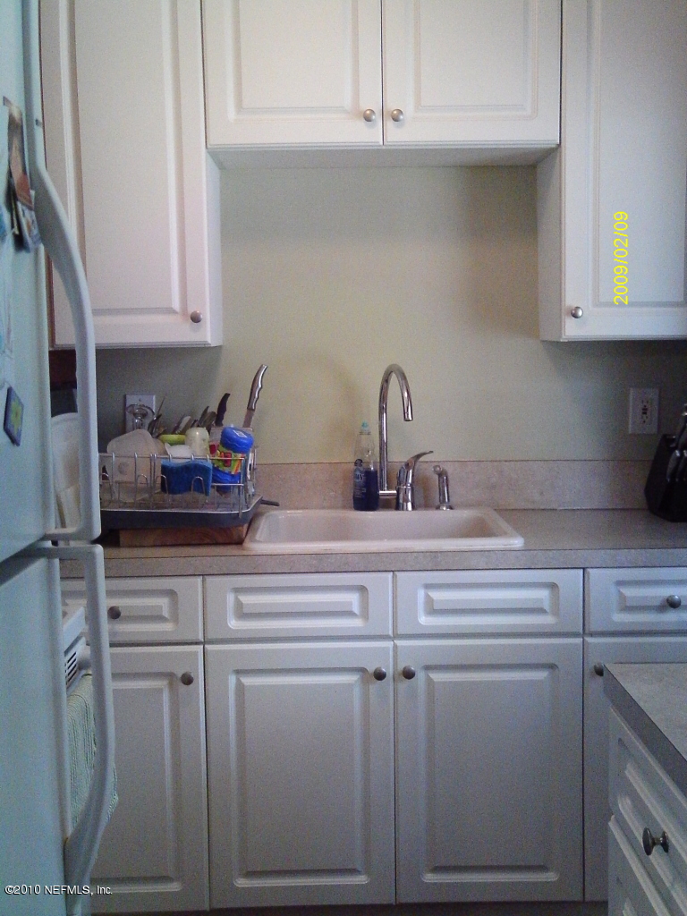2045 Kingswood Road Jacksonville, FL 32207 - Photo 10 of 22 a kitchen with cabinets appliances and a sink