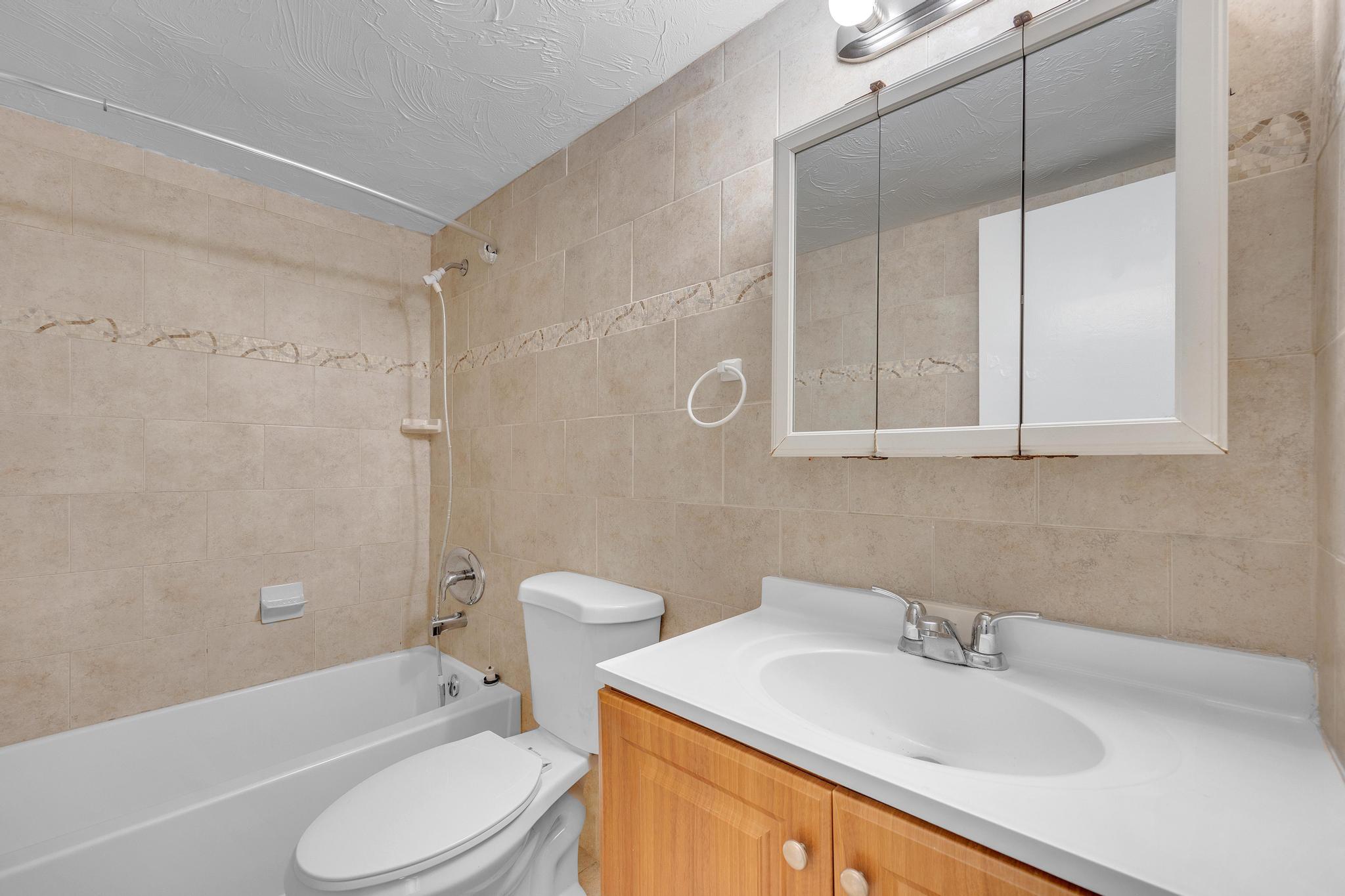 1129 Pebble Beach Lane, Unit 6 Marathon, FL 33050 - Photo 14 of 32 a bathroom with a sink toilet and shower