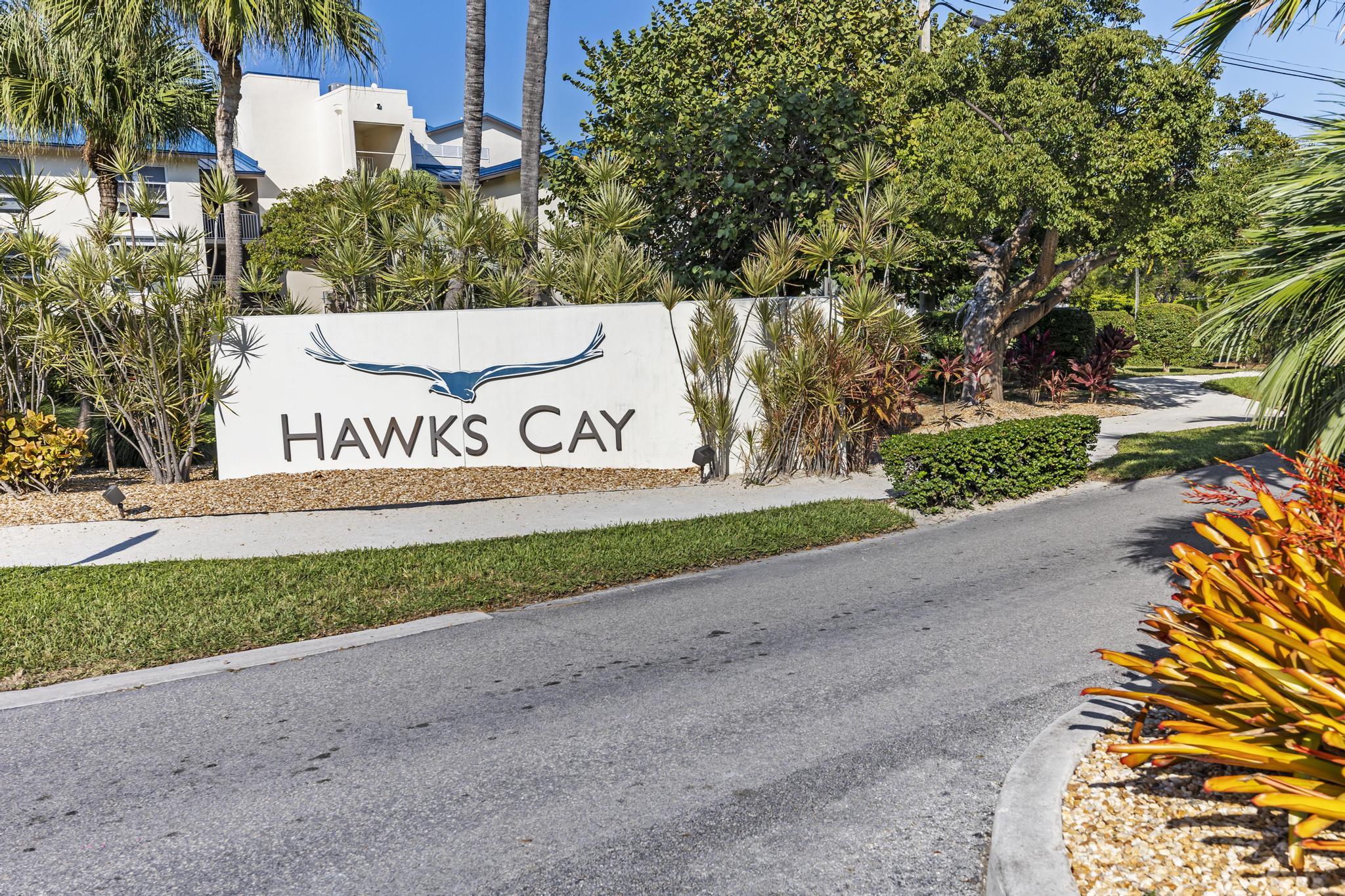 1129 Pebble Beach Lane, Unit 6 Marathon, FL 33050 - Photo 2 of 32 a sign that is on the side of a road