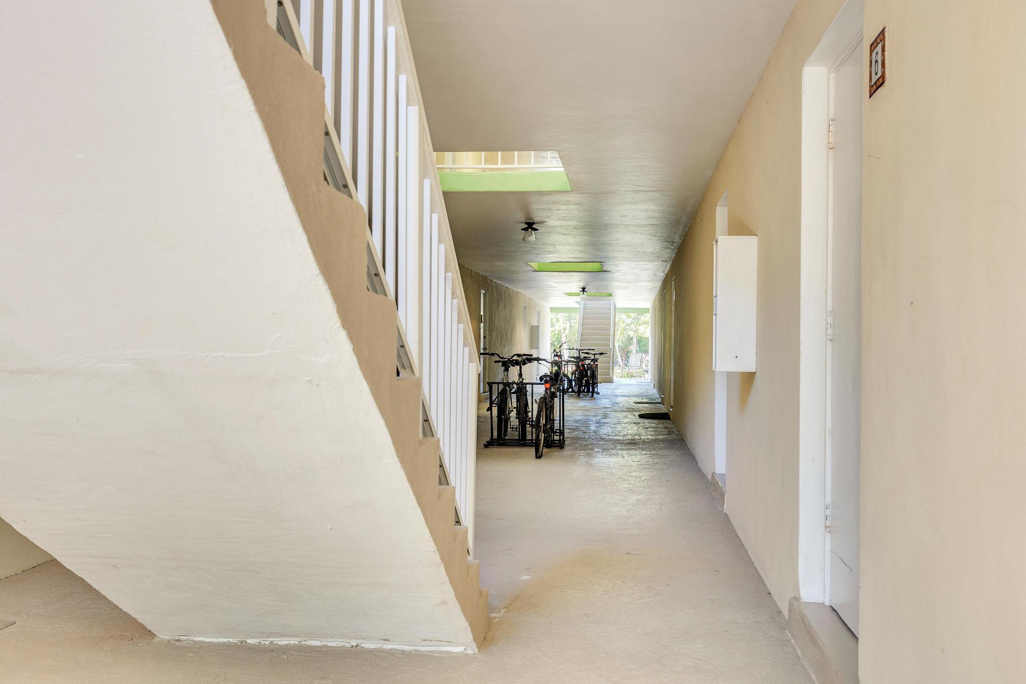 1129 Pebble Beach Lane, Unit 6 Marathon, FL 33050 - Photo 21 of 32 a view of a hallway with furniture and stairs