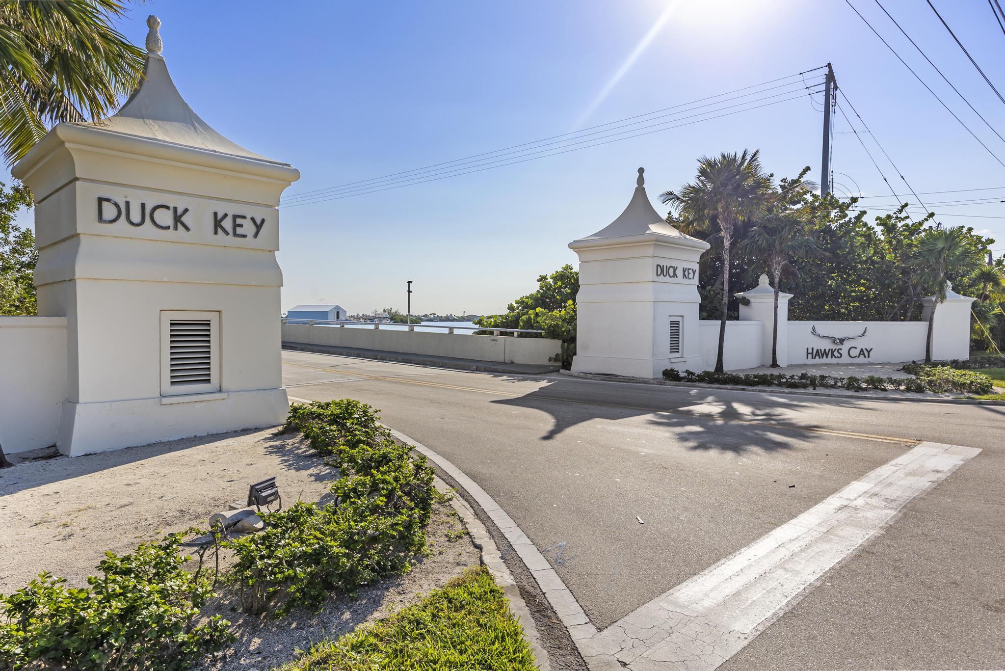 1129 Pebble Beach Lane, Unit 6 Marathon, FL 33050 - Photo 3 of 32 a sign board on the side of a road