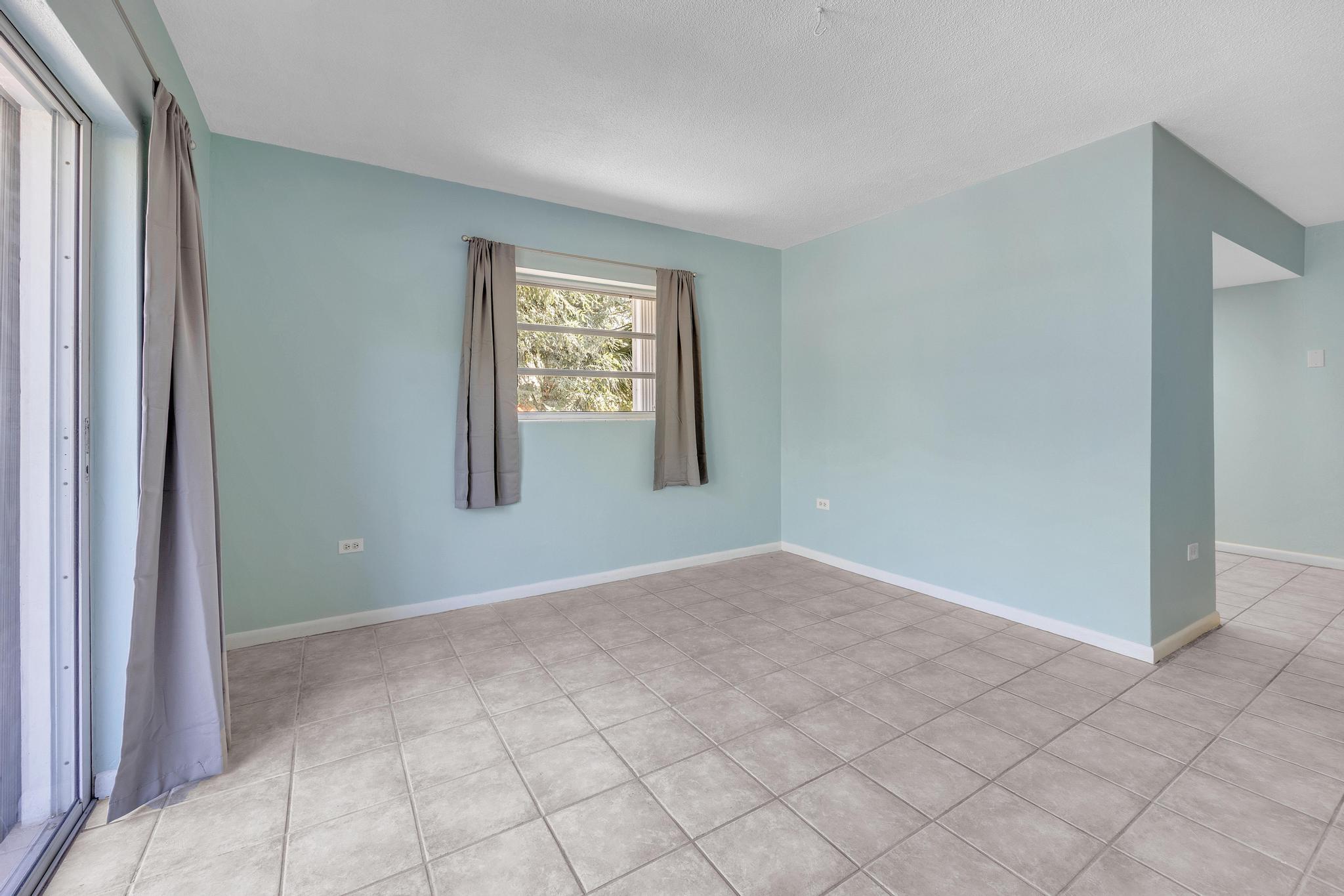 1129 Pebble Beach Lane, Unit 6 Marathon, FL 33050 - Photo 7 of 32 an empty room with windows