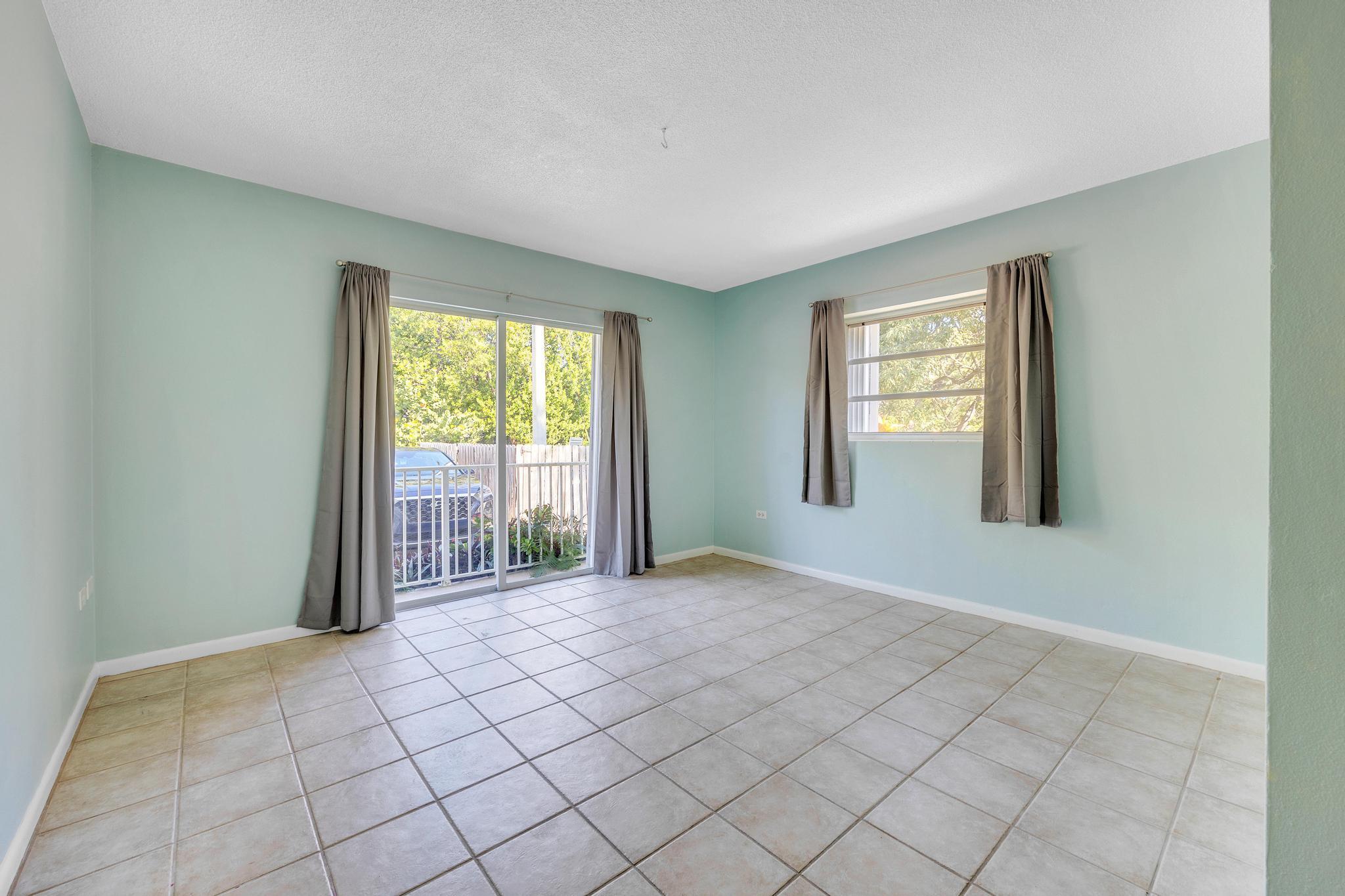 1129 Pebble Beach Lane, Unit 6 Marathon, FL 33050 - Photo 8 of 32 an empty room with windows