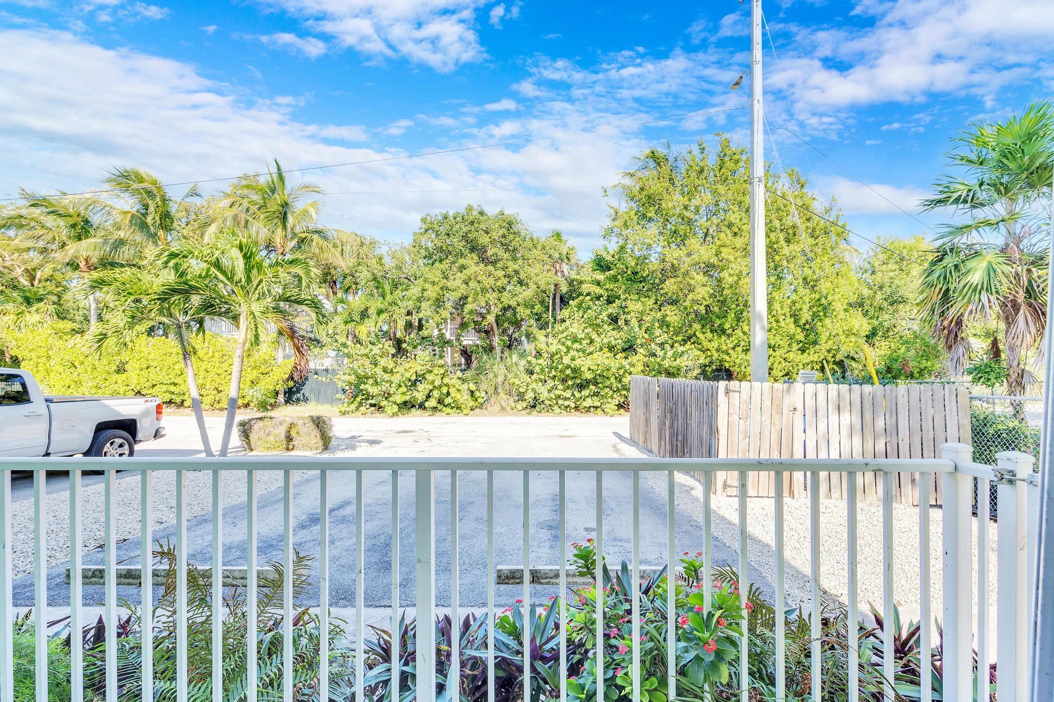 1129 Pebble Beach Lane, Unit 6 Marathon, FL 33050 - Photo 9 of 32 a view of a wooden fence