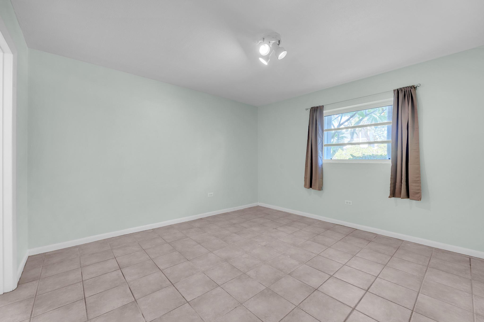 1129 Pebble Beach Lane, Unit 6 Marathon, FL 33050 - Photo 10 of 32 an empty room with windows