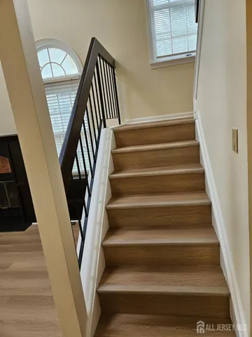 a view of a hallway with staircase