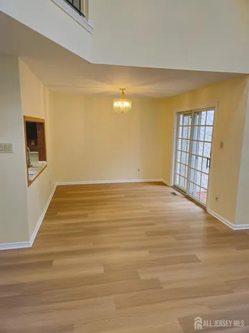 a kitchen with wooden cabinets a stove and a microwave