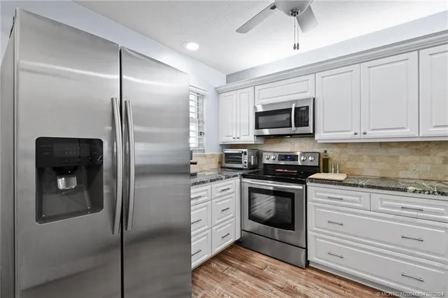 a bedroom with a bed and a cabinets