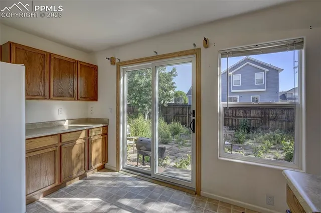 a kitchen with stainless steel appliances granite countertop a stove and a refrigerator