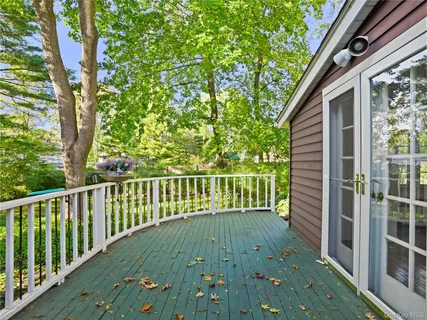 a view of balcony with wooden floor