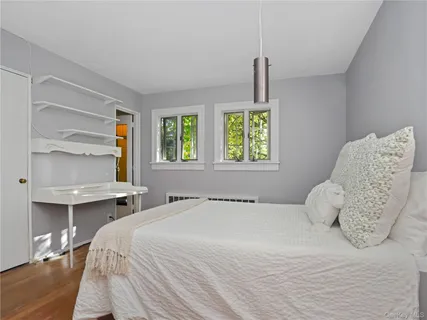 a bedroom with a bed and window