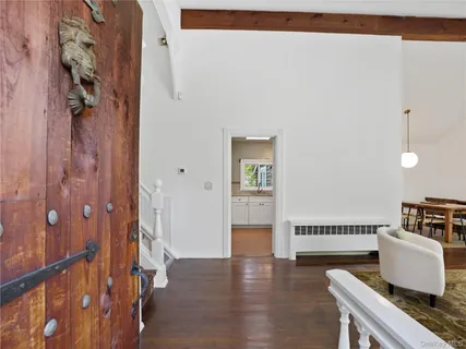 a view of kitchen with furniture and wooden floor