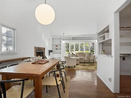 a view of a dining room with furniture window and outside view
