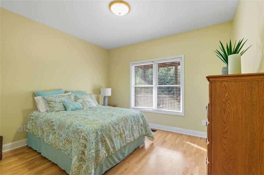1091 Echota Road Clarkesville, GA 30523 - Photo 29 of 89 a bedroom with a bed and a window