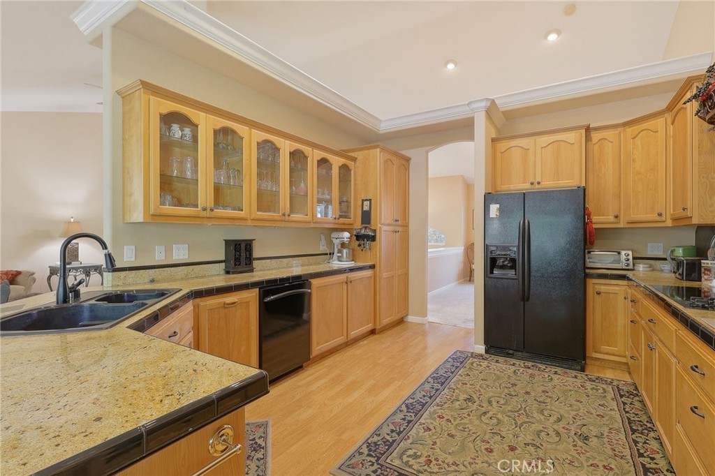 19370 Park Ridge Drive Hidden Valley Lake, CA 95467 - Photo 28 of 61 a kitchen with stainless steel appliances granite countertop a refrigerator sink and cabinets