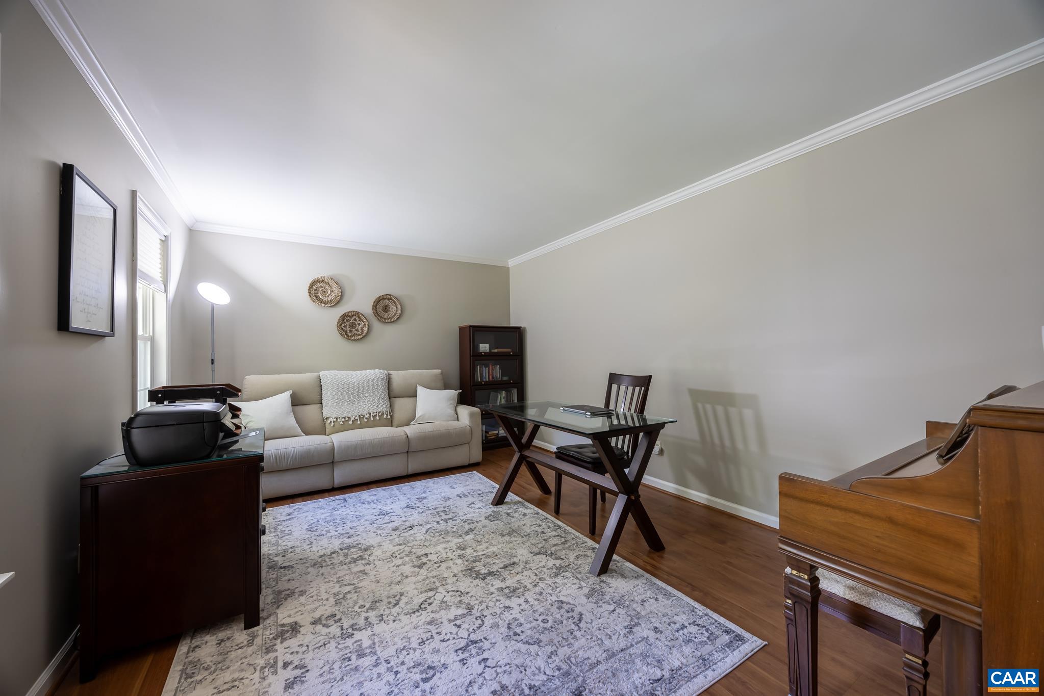 3221 Poplar Ridge Road Charlottesville, VA 22911 - Photo 13 of 72 a living room with furniture rug and wooden floor