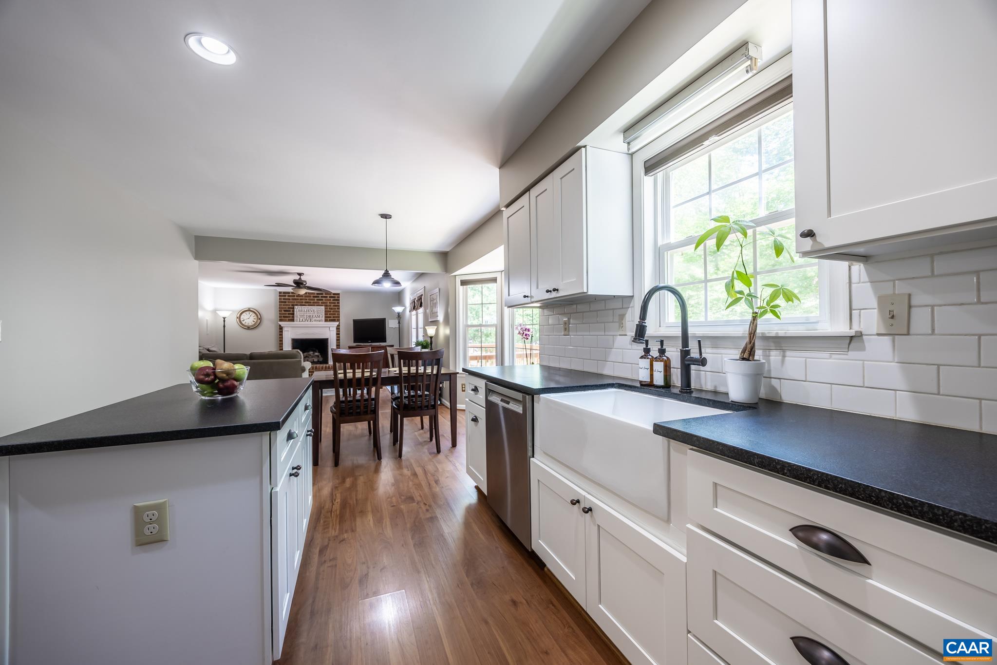 3221 Poplar Ridge Road Charlottesville, VA 22911 - Photo 19 of 72 a kitchen with lots of counter top space and a wooden floor