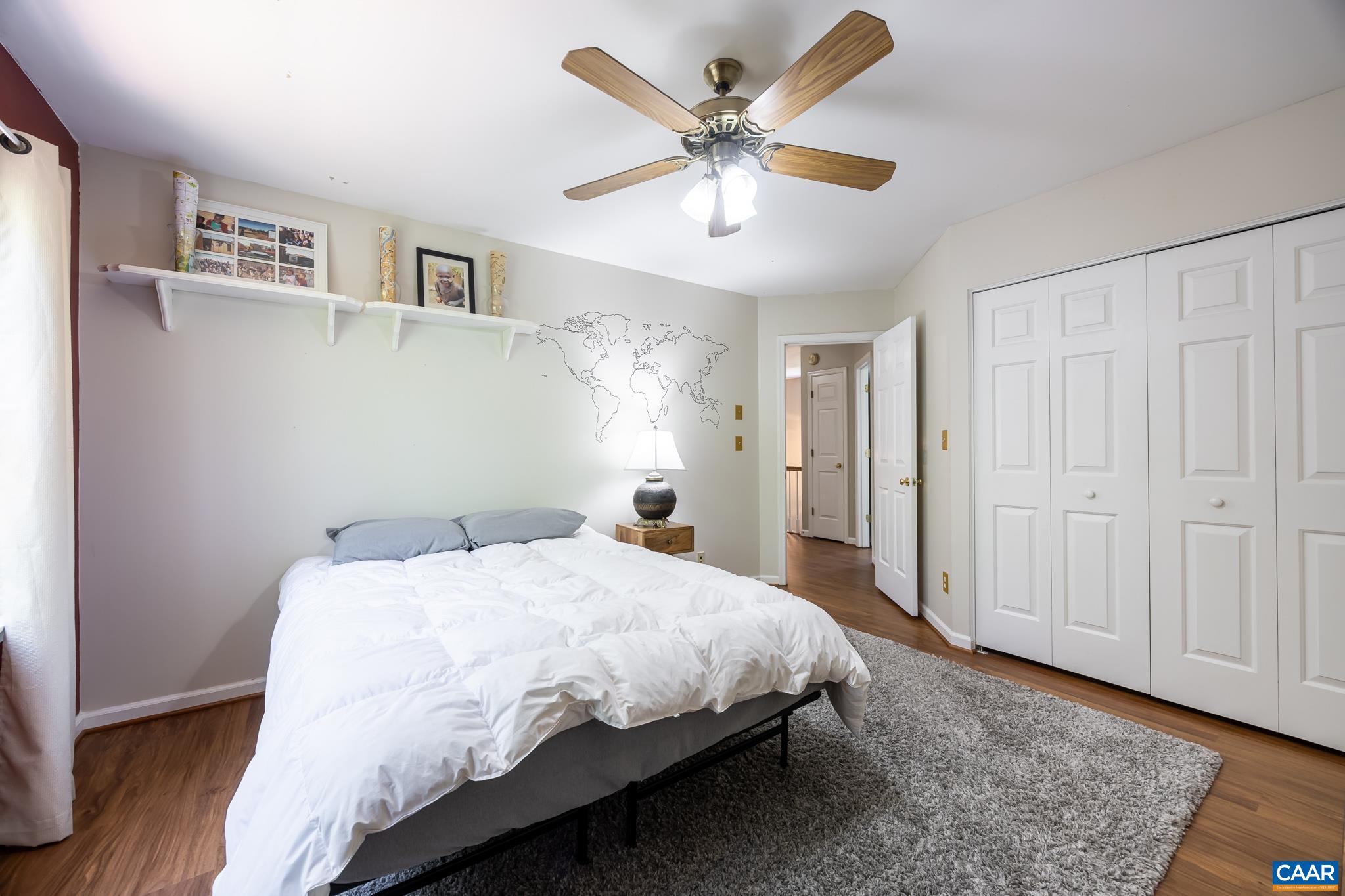 3221 Poplar Ridge Road Charlottesville, VA 22911 - Photo 34 of 72 a bedroom with a bed and a chandelier