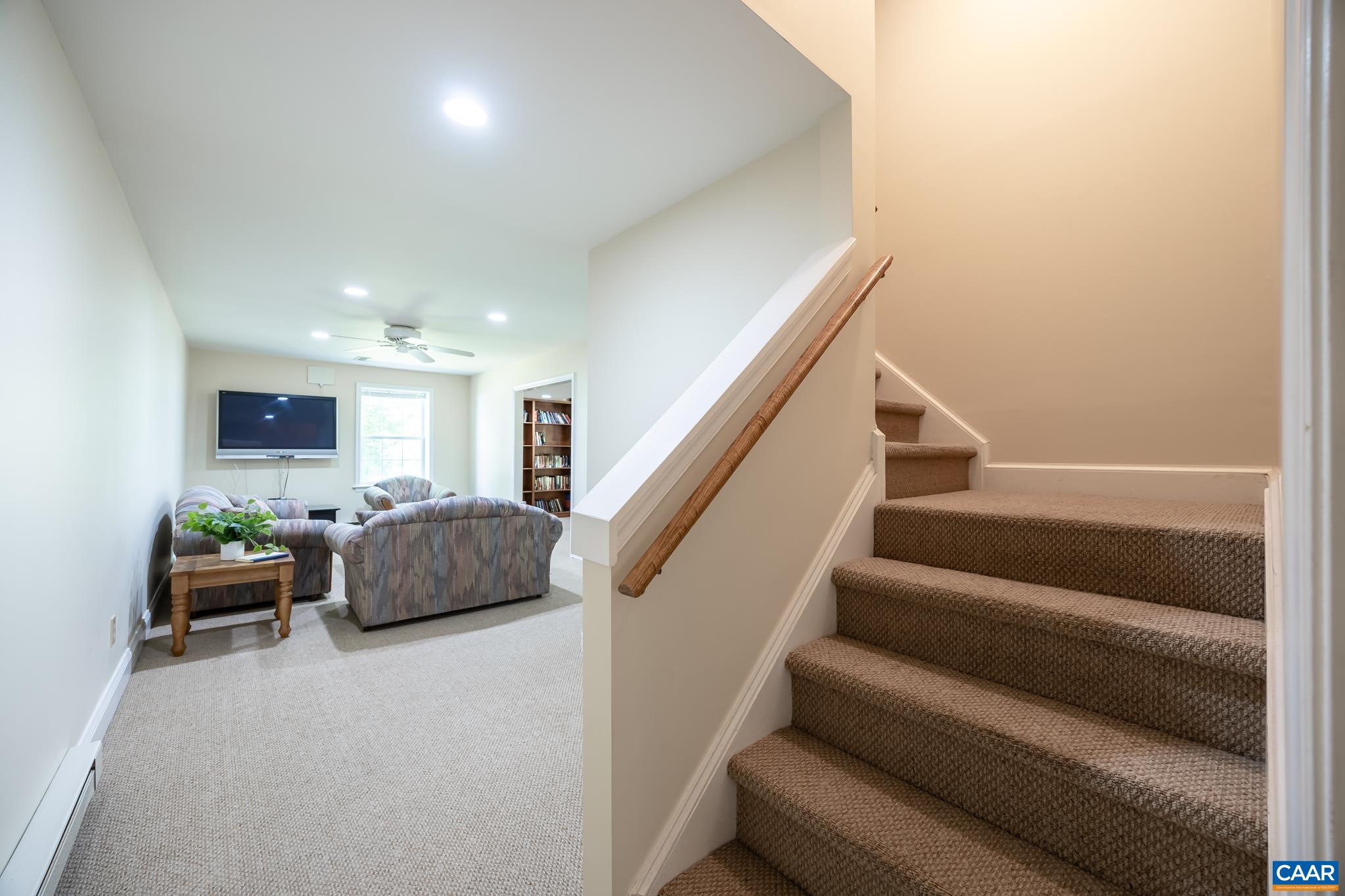 3221 Poplar Ridge Road Charlottesville, VA 22911 - Photo 37 of 72 a living room with furniture and stairs