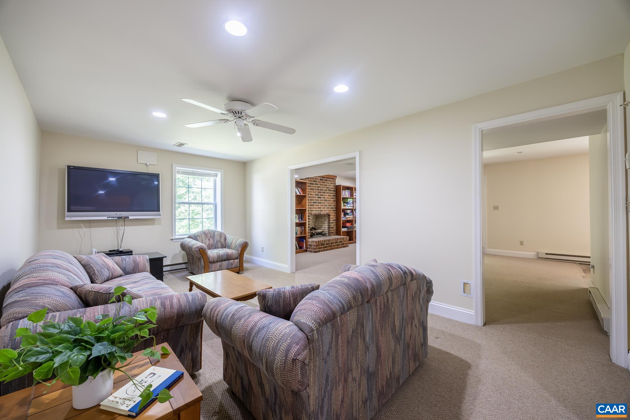 3221 Poplar Ridge Road Charlottesville, VA 22911 - Photo 38 of 72 a living room with furniture and a ceiling fan
