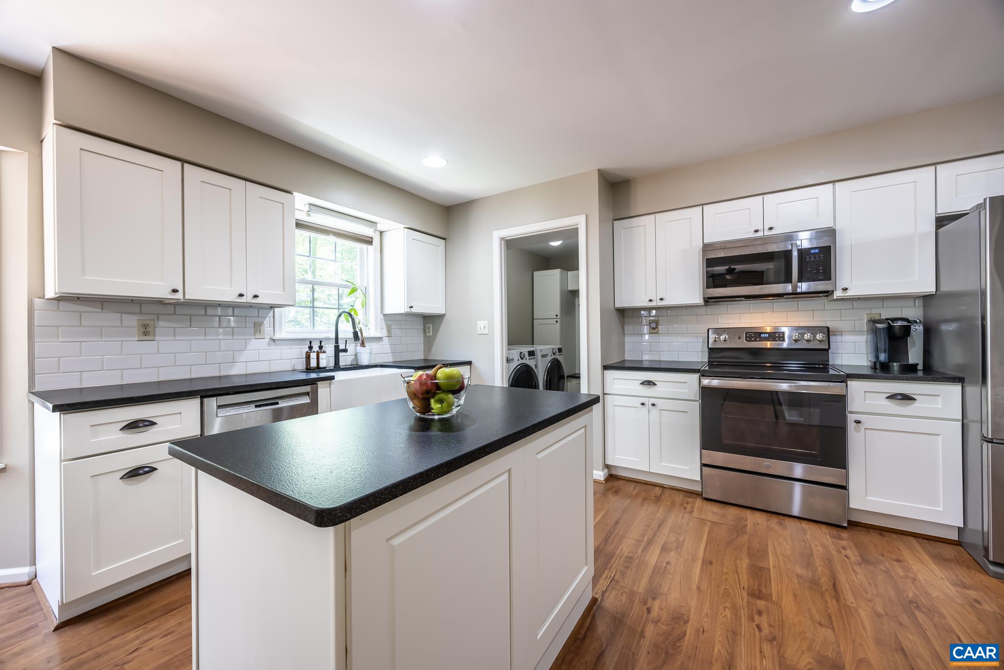 3221 Poplar Ridge Road Charlottesville, VA 22911 - Photo 4 of 72 a kitchen with granite countertop a sink cabinets and stainless steel appliances