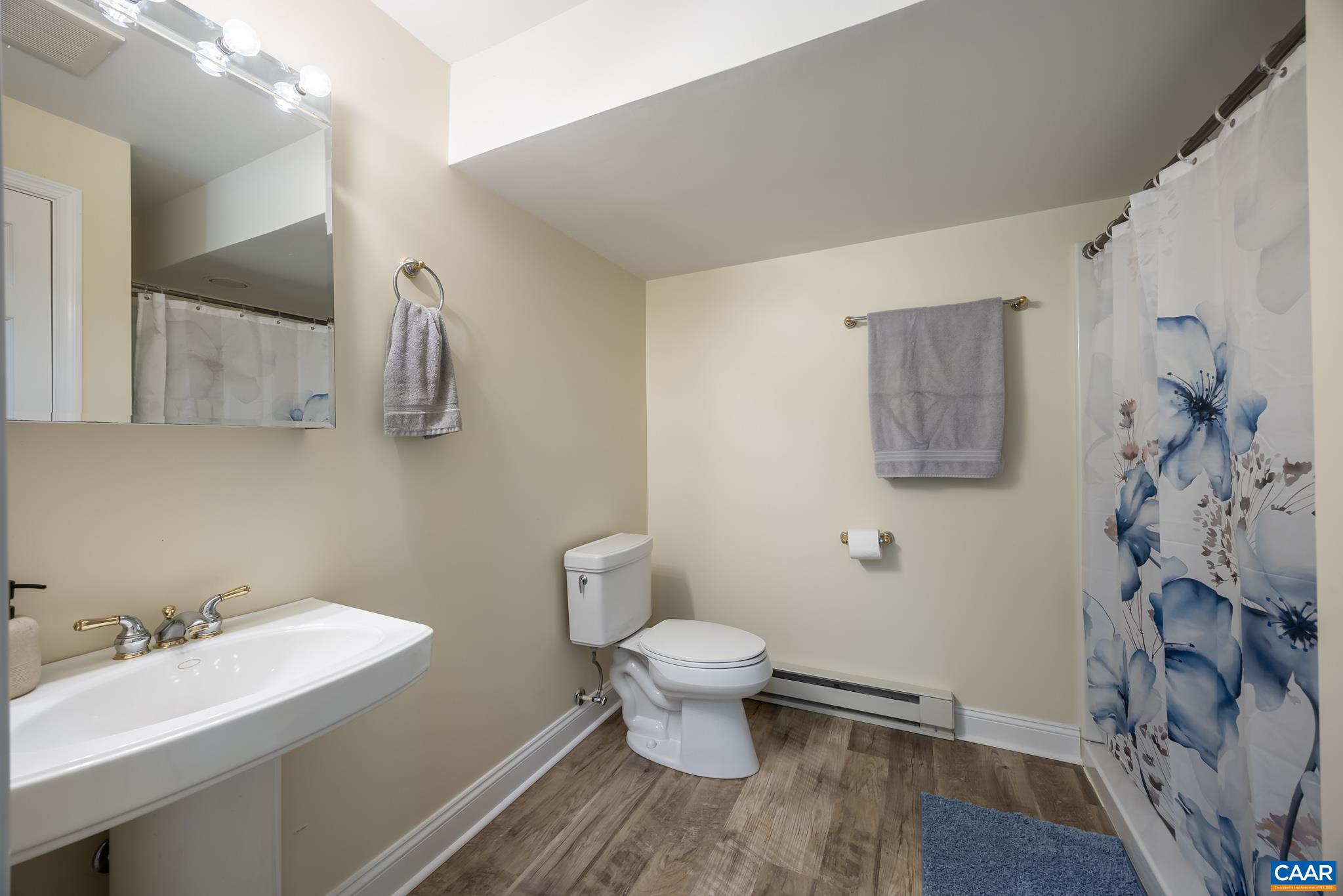 3221 Poplar Ridge Road Charlottesville, VA 22911 - Photo 45 of 72 a bathroom with a sink toilet and a mirror