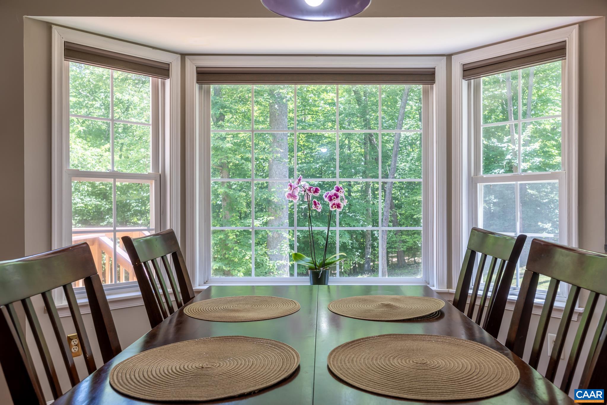 3221 Poplar Ridge Road Charlottesville, VA 22911 - Photo 6 of 72 a view of a dining room with furniture window and wooden floor