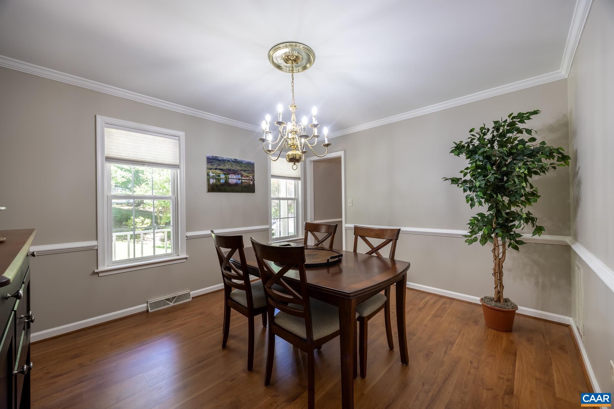 3221 Poplar Ridge Road Charlottesville, VA 22911 - Photo 9 of 72 a dining room with chandelier and wooden floor
