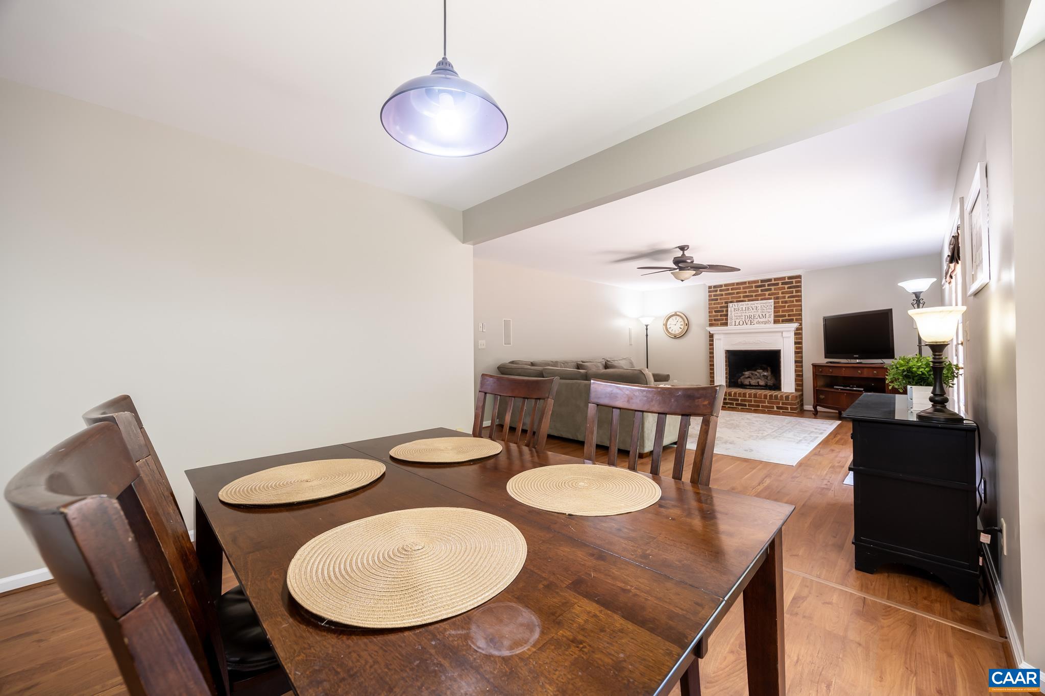 3221 Poplar Ridge Road Charlottesville, VA 22911 - Photo 10 of 72 a kitchen with stainless steel appliances a dining table and chairs