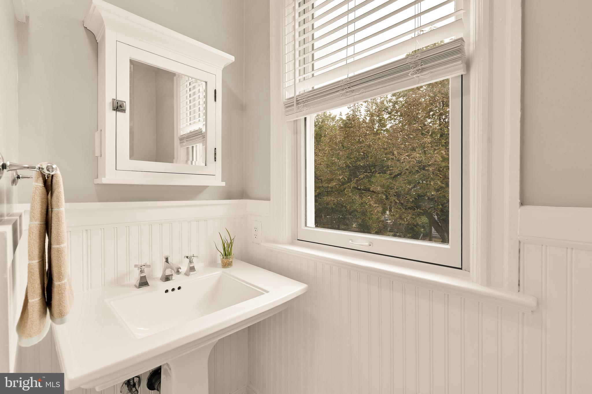 222 Tennessee Avenue Northeast Washington, DC 20002 - Photo 14 of 29 a bathroom with a sink and a window
