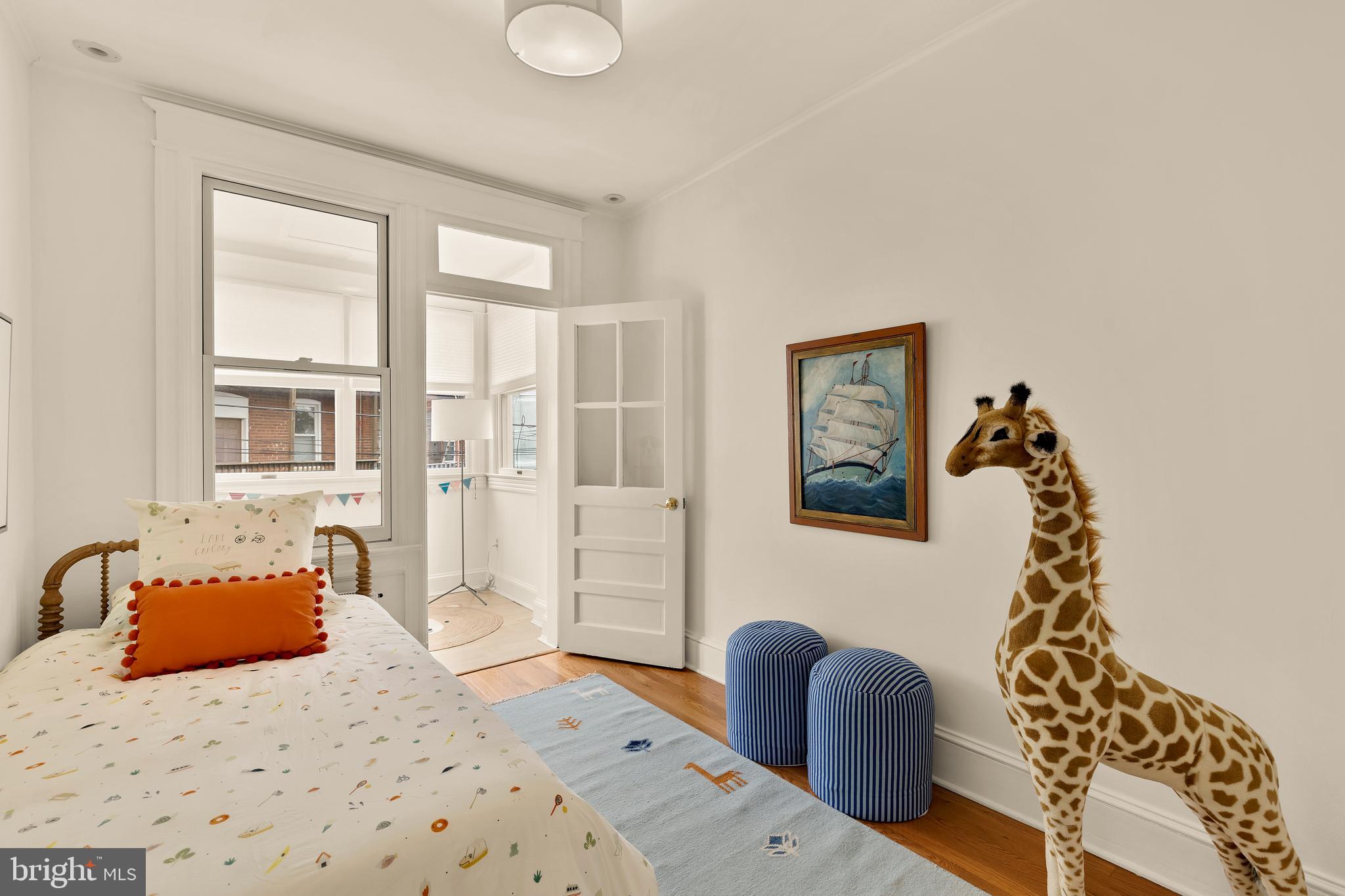 222 Tennessee Avenue Northeast Washington, DC 20002 - Photo 16 of 29 a bedroom with furniture and a window